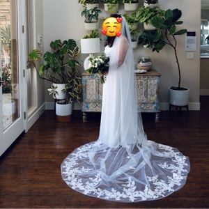 Single layer, soft white cathedral length veil with flower appliqués